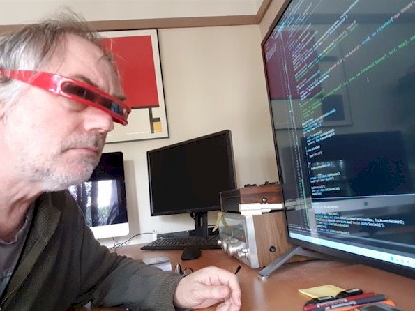 Greg working at his computer